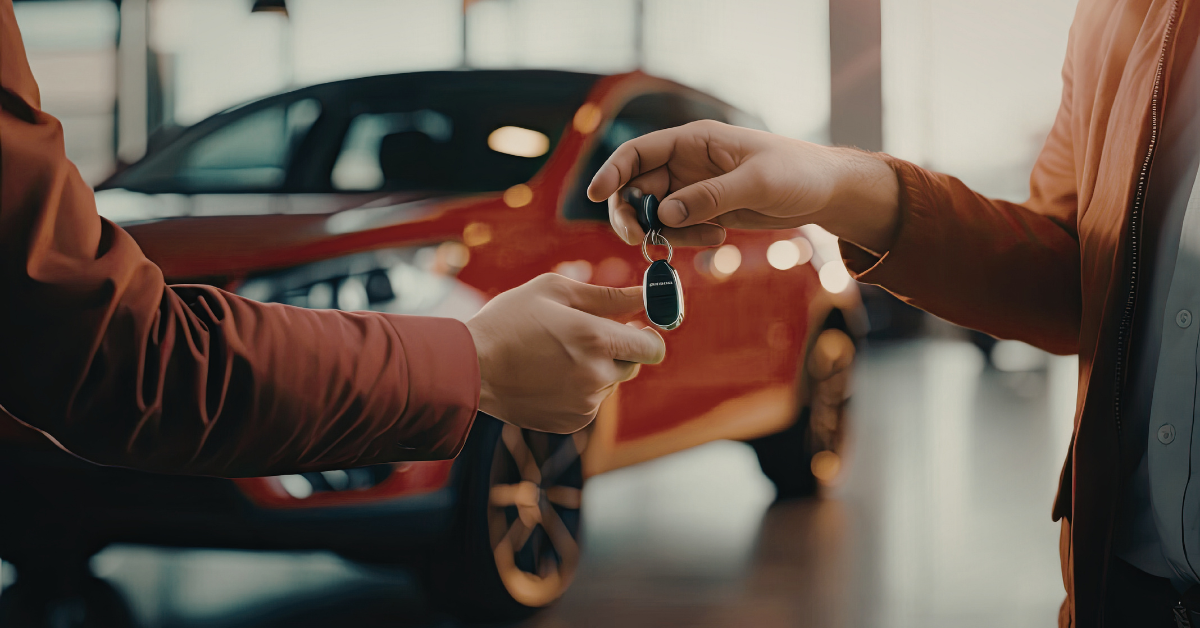 buying a car with RTA. 2 individuals handing over car keys with a car in the background
