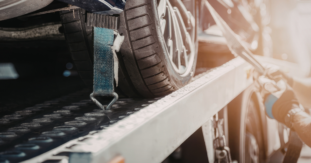 a car being towed away due to repossession